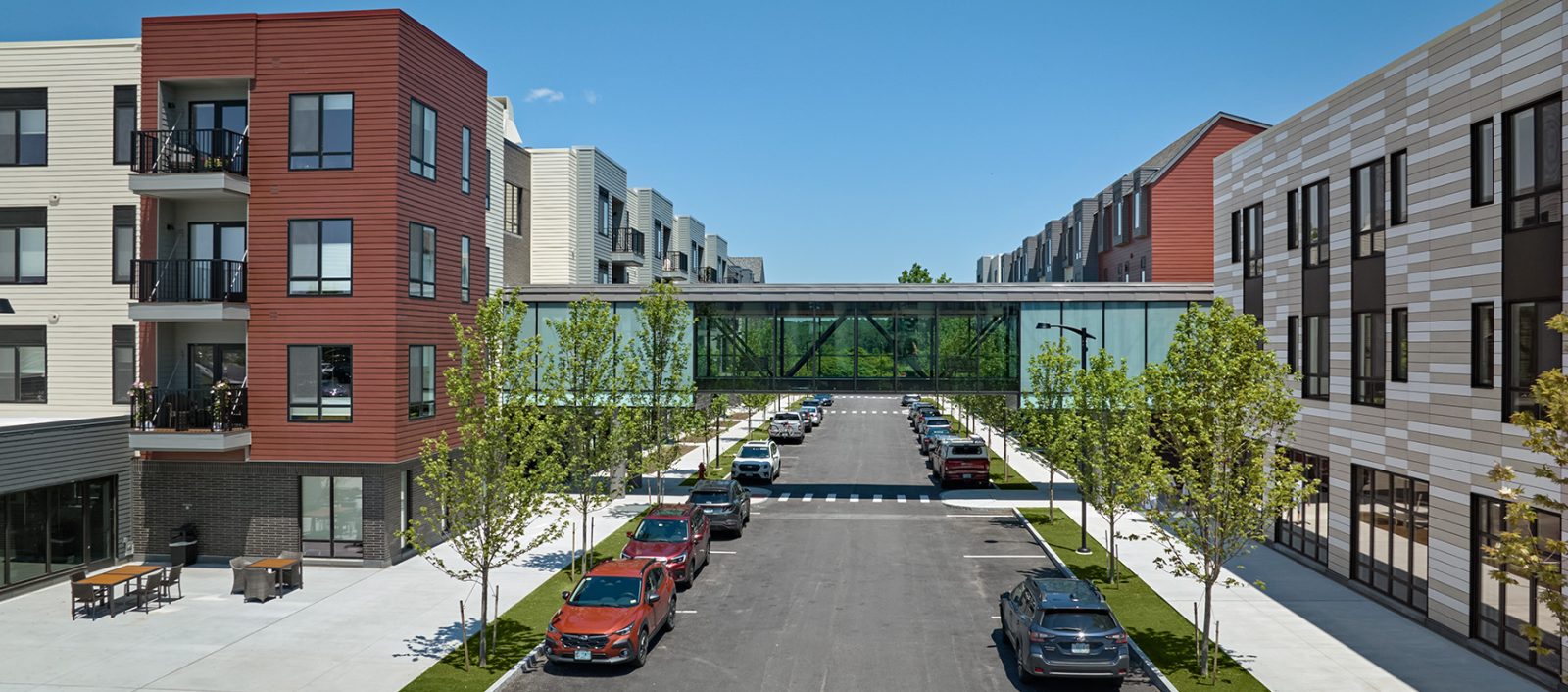 Street view of the Baldwin featuring a skybridge with modern architecture.