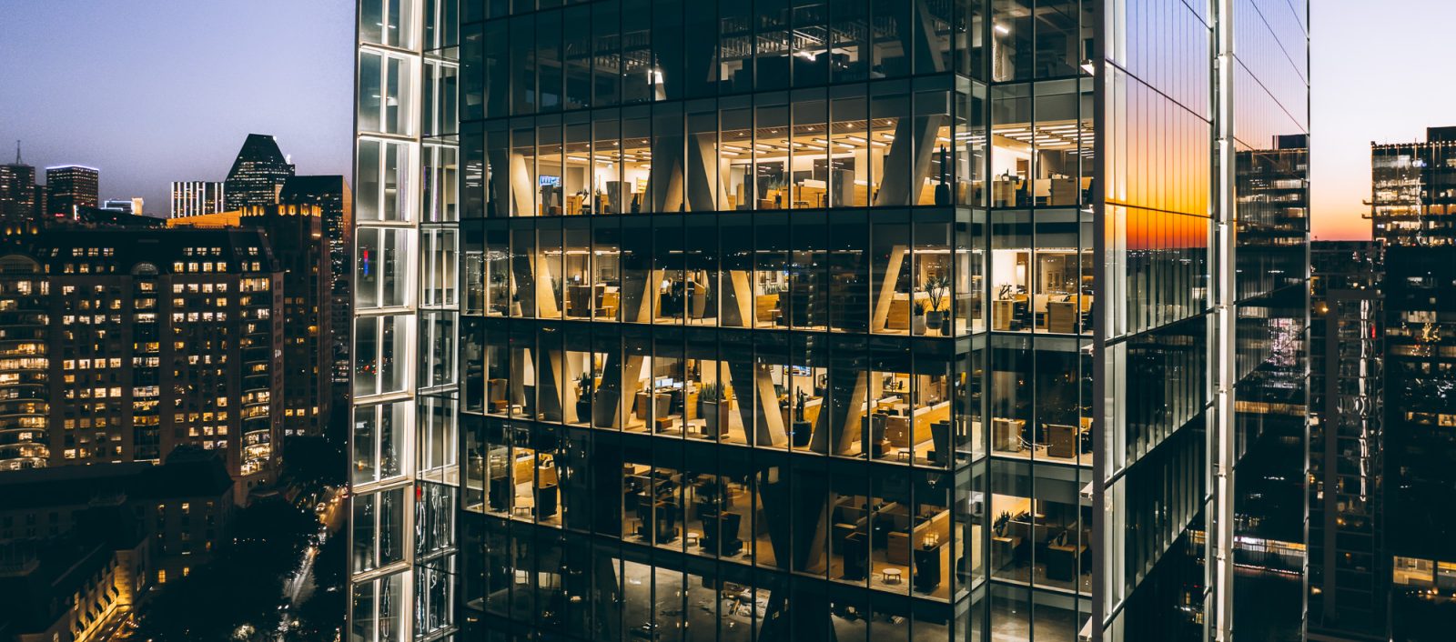 Exterior close up night time view of the 23 springs office building