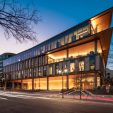 Exterior view of office building at 2915 Vine Street in Dallas, Texas at dusk featuring illuminated hallways and modern architecture.