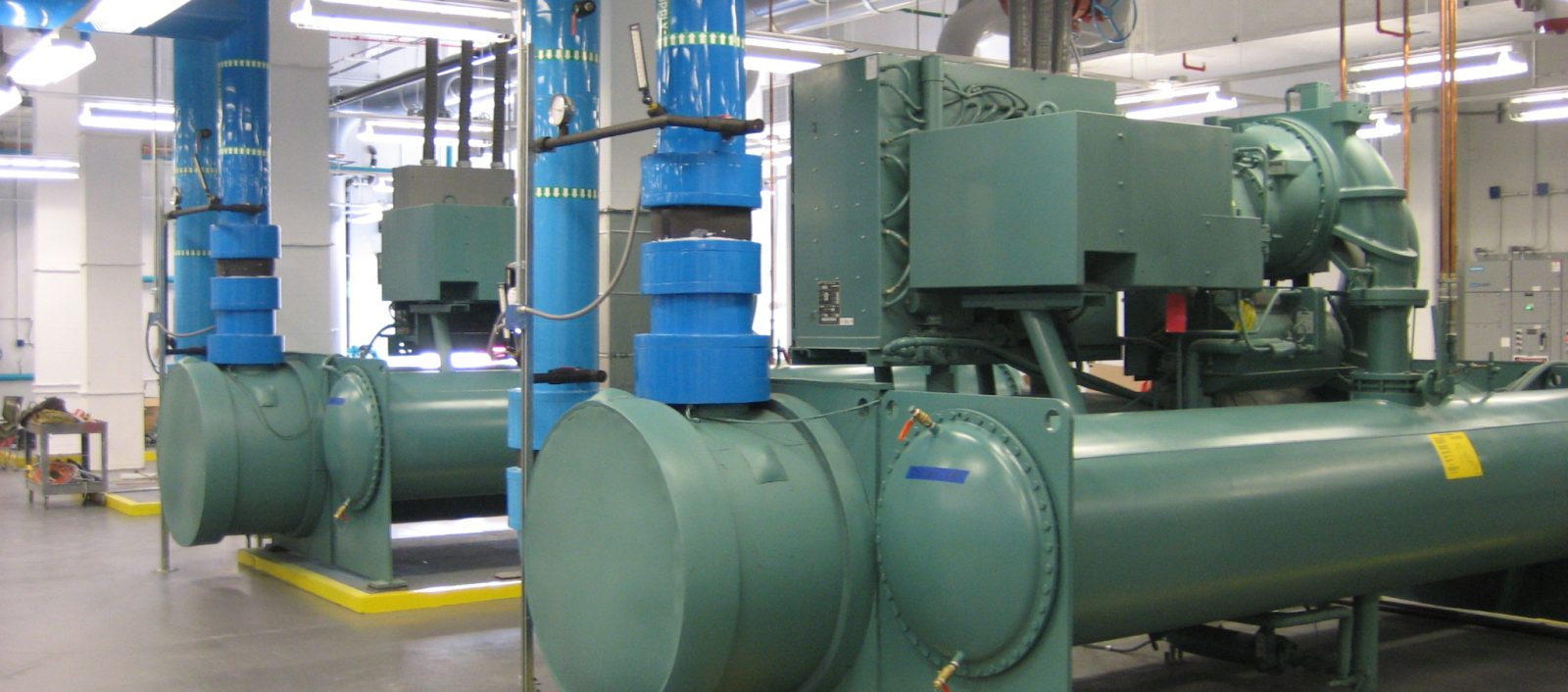 Interior of Oxmoor, a 1-story data center industrial facility with large pipe and machinery, highlighting the structural engineering of the building