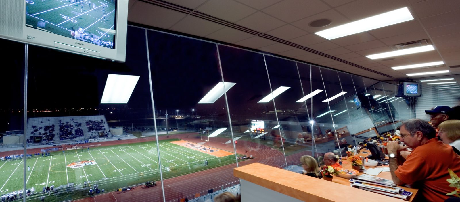 Lancaster ISD High School Stadium Press Box with large clear glass windows looking out to the stadium.